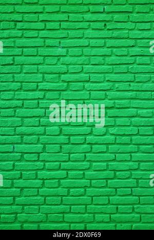 Vertical Photo of Vivid Green Colored Old Brick Wall for Background and Wallpaper Stock Photo