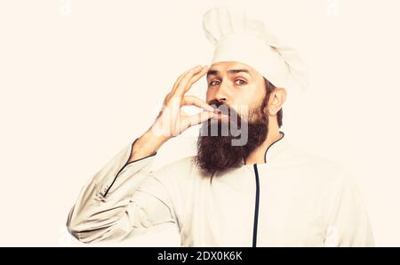Bearded male chefs, perfect. Professional chef man showing sign for delicious. Chef, cook making tasty delicious gesture by kissing fingers Stock Photo