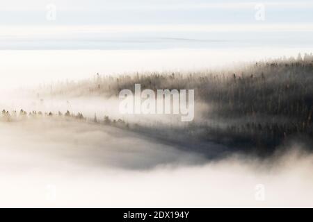 Large fells in fog during a morning in Northern Finland in autumn. Stock Photo