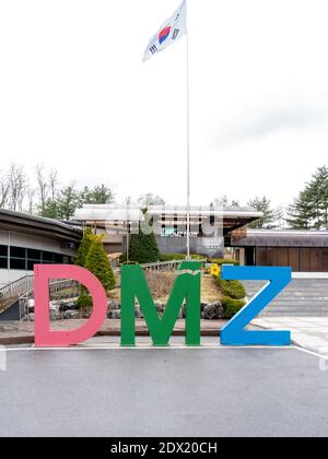 DMZ sign with flag at the 3rd North Korean Tunnel Visitor Center, along the 38th Parallel in the South Korea  Demilitarized Zone. Stock Photo