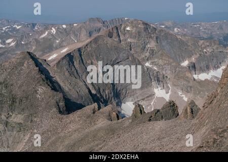 The view from the summit of Longs Peak, on a hazy summer day in Rocky Mountain National Park. Stock Photo