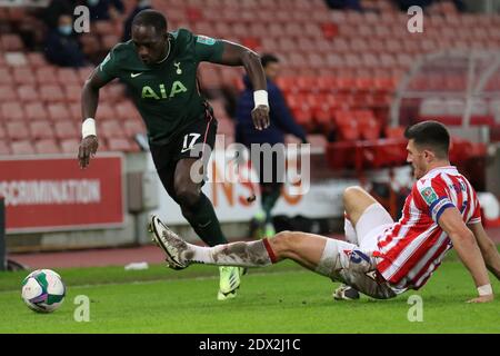 Stoke On Trent, UK. 23rd Dec, 2020. Stoke City defender Danny Batth (6) attempts to tackle Tottenham Hotspur midfielder Moussa Sissoko (17) during the EFL Carabao Cup Quarter-Final match between Stoke City and Tottenham Hotspur at the bet365 Stadium, Stoke-on-Trent, England on 23 December 2020. Photo by Jurek Biegus. Editorial use only, license required for commercial use. No use in betting, games or a single club/league/player publications. Credit: UK Sports Pics Ltd/Alamy Live News Stock Photo