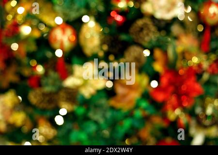 defocused abstract scene background in christmas tree and festive details. Concept of New Year and family festivitie Stock Photo