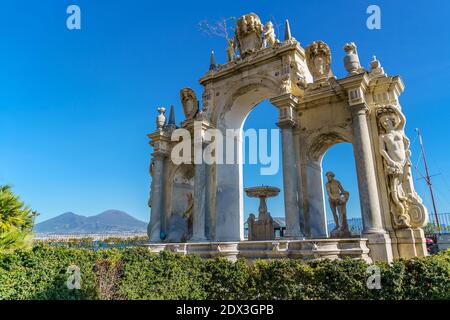 The Gigante Fountain on the seafront of Naples Campania Italy, The Vesuvius Volcano on background. Stock Photo