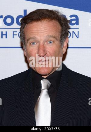 US actor Robin Williams has been found dead, aged 63, in an apparent suicide, California police say Monday August 11, 2014. Marin County Police said he was pronounced dead at his home shortly after officials responded to an emergency call around noon local time. Williams was famous for films such as Good Morning Vietnam and Dead Poets Society and won an Oscar for his role in Good Will Hunting; File photo : Robin Williams attends the 13th Annual Benefit for Scleroderma Research at the Beverly Regent Hotel. Los Angeles, March 26, 2004. (Pictured: Robin Williams). Photo by Lionel Hahn/Abaca. Stock Photo