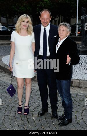 Emmanuelle Seigner, Stefano Cantino and Roman Polanski arriving for the Miu Miu Resort Collection Presentation at the Conseil Economique et Social in Paris, France on July 05, 2014. Photo by Aurore Marechal/ABACAPRESS.COM Stock Photo