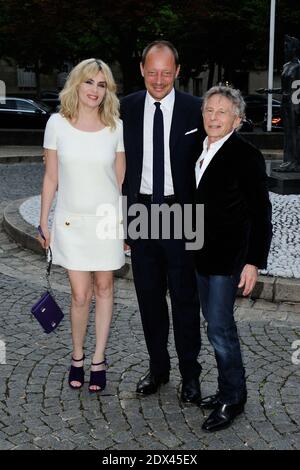 Emmanuelle Seigner, Stefano Cantino and Roman Polanski arriving for the Miu Miu Resort Collection Presentation at the Conseil Economique et Social in Paris, France on July 05, 2014. Photo by Aurore Marechal/ABACAPRESS.COM Stock Photo