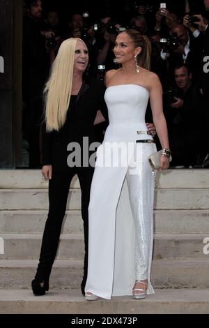 Donatella Versace and Jennifer Lopez attending Versace's Fall-Winter 2014/2015 Haute Couture collection show held at Salon de la Chambre de Commerce et de l'Industrie in Paris, France, on July 6, 2014. The international sensation was absolutely a vision in a preview of the Atelier Fall 2014 collection: she wore a strapless pure white Atelier Versace gown with thigh high slit and one fully beaded pant leg, accented with two metallic straps on the hip, which were a key component of the new collection. Photo by Audrey Poree/ABACAPRESS.COM Stock Photo