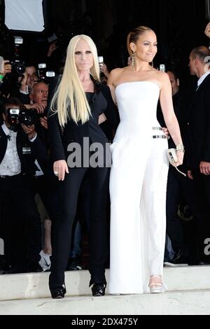 Donatella Versace and Jennifer Lopez attending Versace's Fall-Winter 2014/2015 Haute Couture collection show held at the Salon de la Chambre de Commerce et de l'Industrie in Paris, France, on July 06, 2014. The international sensation was absolutely a vision in a preview of the Atelier Fall 2014 collection: she wore a strapless pure white Atelier Versace gown with thigh high slit and one fully beaded pant leg, accented with two metallic straps on the hip, which were a key component of the new collection. Photo by Aurore Marechal/ABACAPRESS.COM Stock Photo