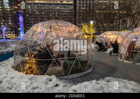 Cozy evening in the festive city. Blurred image of trees decorated with ...