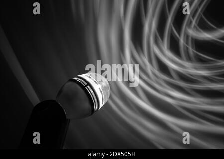Long exposure photography of light traces projected on the screen (B/W) Stock Photo