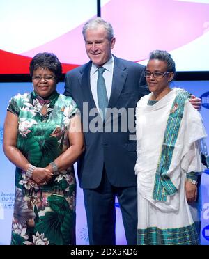 Former United States President George W. Bush, center, poses with Penehupifo Pohamba, first lady of the Republic of Namibia, left, and Roman Tesfaye, first lady of the Federal Democratic Republic of Ethiopia, right, as it was announced the Pink Ribbon Red Ribbon initiative would be expanded to include their countries at the 'Investing in our Future at the U.S. - Africa Leaders Summit at the John F. Kennedy Center for the Performing Arts in Washington, DC, USA, on Wednesday, August 6, 2014. Photo by Ron Sachs/Pool/ABACAPRESS.COM Stock Photo