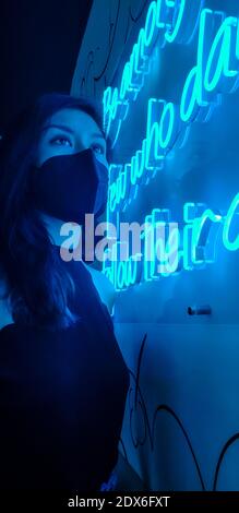 Girl posing in luminous letters Stock Photo