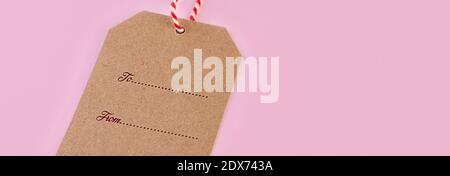 Brown cardboard label with cord with text To From long banner Stock Photo