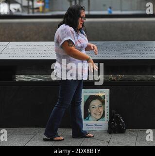 https://l450v.alamy.com/450v/2dx8bty/janice-lynch-of-queens-mourns-the-loss-patricia-ann-cimaroli-massari-at-the-north-pool-during-memorial-observances-held-at-the-site-of-the-world-trade-center-in-new-york-city-ny-usa-on-september-11-2014-photo-by-robert-sabonew-york-daily-newspoolabacapresscom-2dx8bty.jpg