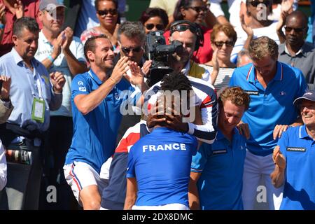 France's Richard Gasquet celebrates with team mates after he won the 1-0 point against Czech Republic's Thomas Berdych 6-3 6-2 6-3 in the semi-final of the Tennis Davis Cup 2014 in Stade Roland-Garros, Paris, France on September 12th, 2014. Photo by Henri Szwarc/ABACAPRESS.COM Stock Photo