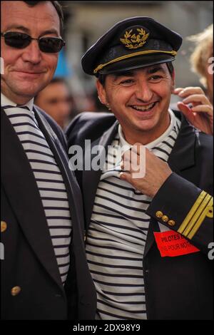 French pilots of Air France company demonstrate near French Parliament in Paris, France, on September 23, 2014. French Prime Minister Manuel Valls speaks out against Air France pilots who are striking for an eighth day over the proposed expansion of its low-cost carrier, Transavia. The strike forced the airline to cancel about 60% of its flights, is undermining its precarious finances, causing a daily operating loss of 20 million euros. Photo by Renaud Khanh/ABACAPRESS.COM Stock Photo