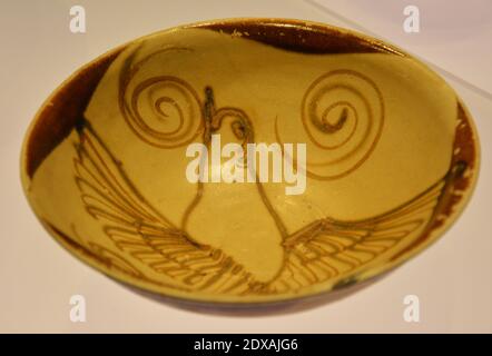 an ancient bowl with bird figure showed in the museum in Shanghai Stock Photo