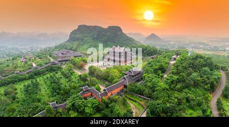 Sunset landscape of Bai Dinh temple complex from above is one of the biggiest and largest temple Southeast Asia in Ninh Binh, Vietnam. Stock Photo