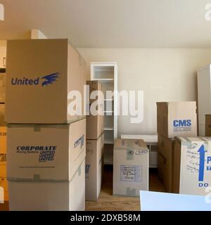 Seattle, WA USA - February 21. 2020:  Packed moving boxes in an apartment waiting to be loaded on the moving van. Stock Photo