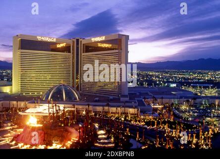 The Mirage Hotel on the Strip in Las Vegas, Nevada at dusk with volcano fountain erupting. Stock Photo