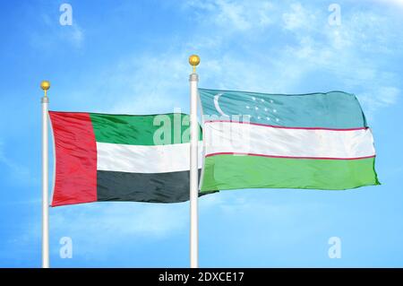 Uzbekistan and United Arab Emirates flags waving on isolated white ...