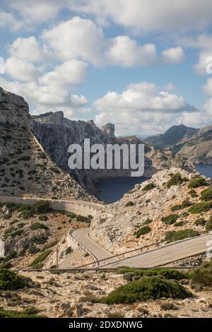 Empty road winding along edge of Cap de Formentor headland Stock Photo