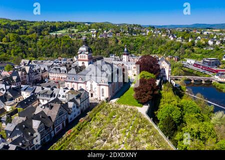 Germany, Weilburg, Weilburg Castle with baroque palace complex, old town hall and castle church with tower, aerial view Stock Photo