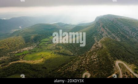Aerial view of forested mountain valley at dusk Stock Photo