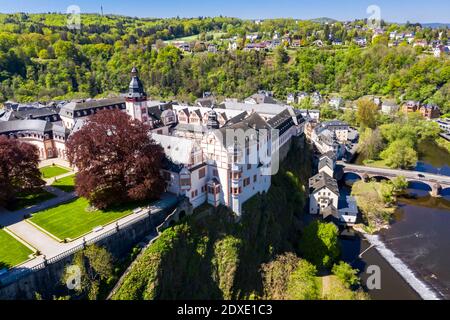 Germany, Weilburg, Weilburg Castle with baroque palace complex, old town hall and castle church with tower, aerial view Stock Photo