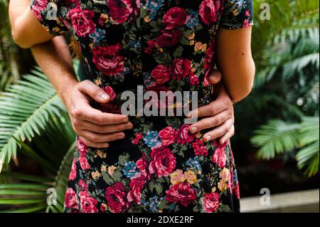 Heterosexual couple embracing in park Stock Photo