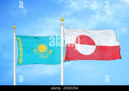 Kazakhstan and Greenland two flags on flagpoles and blue sky
