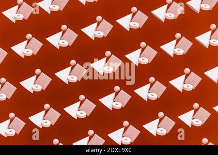 Pattern of geometric shapes hovering against red background Stock Photo