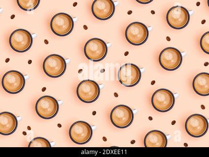 Pattern of coffee beans and mugs of coffee Stock Photo