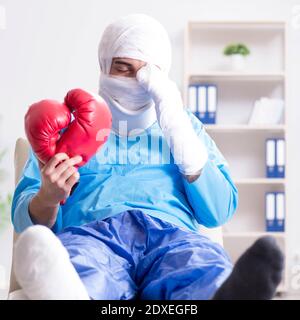 The injured boxer recovering in hospital Stock Photo