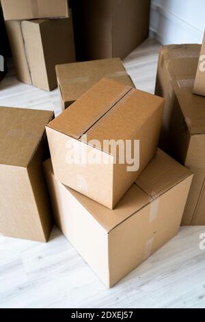 Stack of cardboard boxes at new house Stock Photo