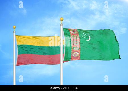 Lithuania and Turkmenistan two flags on flagpoles and blue sky Stock Photo