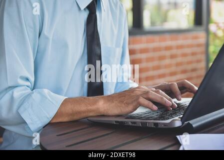Businessman using computer notebook laptop working by internet online technology Stock Photo