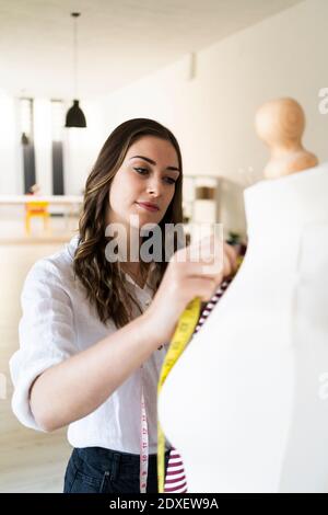 A mannequin with a measuring tape on it's neck. Couture fashion design  model. - PICRYL - Public Domain Media Search Engine Public Domain Search