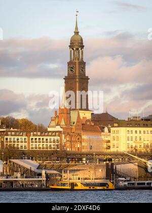 Germany, Hamburg, Bell tower of Saint Michaels Church rising above surrounding buildings Stock Photo