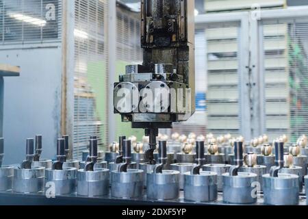 Robotic arm over conveyor belt on production line in factory Stock Photo
