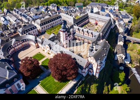 Germany, Weilburg, Weilburg Castle with baroque palace complex, old town hall and castle church with tower, aerial view Stock Photo