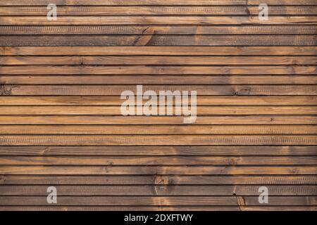 A Fine wood background in dark brown tone. in horizontal position. texture and detail of wood fence. A fine detail background for abstract design. Woo Stock Photo