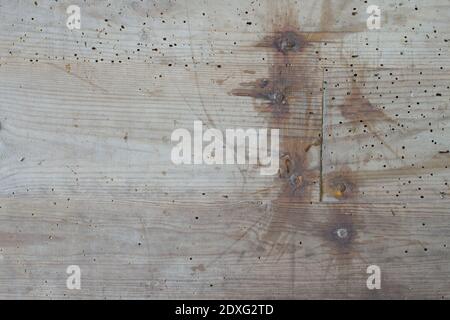 A wood boards very deteriorated by attack of insects. termites. with rusty nails by the passage of time Stock Photo