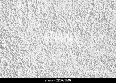 A White cement texture stone concrete,rock plastered stucco wall; painted flat fade pastel background white grey solid floor grain. Rough top Stock Photo