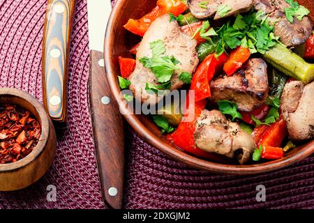 Warm salad with chicken liver and vegetables.Chicken liver salad Stock Photo