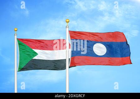 Sudan and Laos two flags on flagpoles and blue sky Stock Photo
