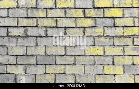 Grunge brickwall stone texture samples brick wall ultimate grey color stain illuminating yellow Stock Photo