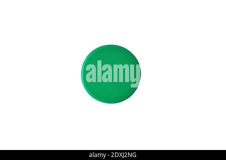 Green plastic bottle cap isolated on white background. Top view. Stock Photo