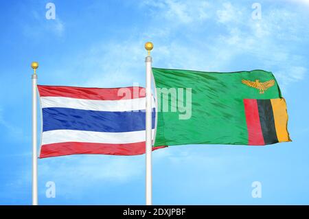 Thailand and Zambia two flags on flagpoles and blue sky Stock Photo